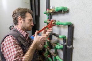 plumber at work installing a water meter